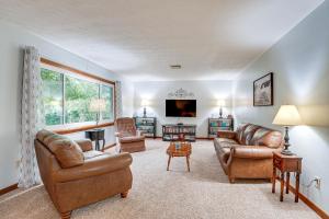a living room with leather furniture and a tv at Fish, Hike and Golf Countryside Retreat in Bluffton in Bluffton