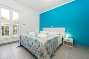 Postel nebo postele na pokoji v ubytování Blue Sky Apartments