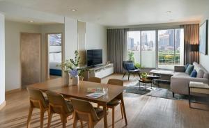 a living room with a table and a couch at Shama Lakeview Asoke Bangkok in Bangkok +195 photos
