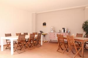 a dining room with a table and chairs at Villa Cresto in Gaglianico