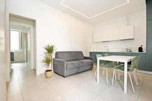 a living room with a couch and a table at La Casina di Luca in Rimini