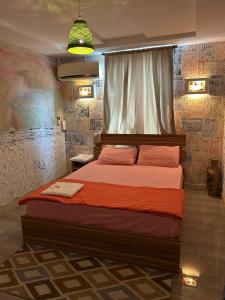 a bedroom with a large bed in a room at King Apartment in Flic-en-Flac