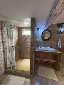 a bathroom with a sink and a shower at King Apartment in Flic-en-Flac +32 photos