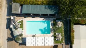 an overhead view of a swimming pool next to a building at Giardini di Marzo Lecce B&B in Lecce
