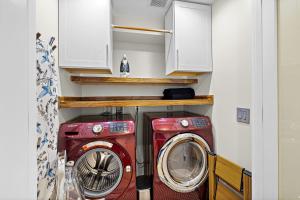 a washer and dryer in a small room at 3BR The Lucille Lake Washington View Retreat in Seattle
