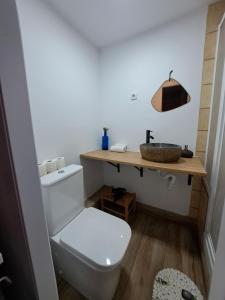 a bathroom with a white toilet and a sink at Barça Barcelona, Mia in Hospitalet de Llobregat
