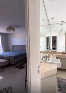 Ένα ή περισσότερα κρεβάτια σε δωμάτιο στο Búzios Mansion Canal Area