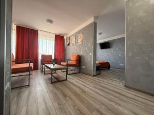 a living room with a couch and a table at Tourist Poltava in Poltava