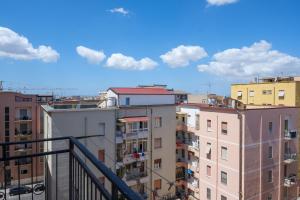 a view of the roofs of buildings in a city at Casa Bea & Gin - Via Giacomo Matteotti 2A in Sassari