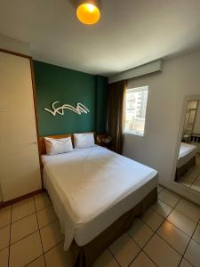 Katil atau katil-katil dalam bilik di Praia do Canto Apart Hotel - 102B