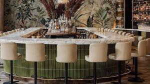 a bar with a large marble table and chairs at Grand Nile Cruise from Luxor in Luxor