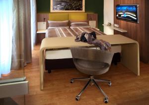 TV a/nebo společenská místnost v ubytování Hotel Adler