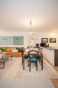 a living room with a table and chairs at Liiiving in Gaia - Cooper Residence Apartment II in Vila Nova de Gaia