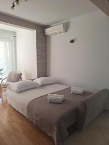 Postel nebo postele na pokoji v ubytování Apartman Amarea Makarska