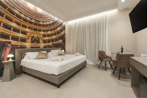 Postel nebo postele na pokoji v ubytování Lolli Boutique & SPA Al Massimo