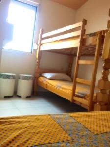 a bunk bed in a room with a window at Savanna Beach in Cap d'Agde