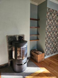 a living room with a stove in a room at Beautiful house in Fränsta in Fränsta