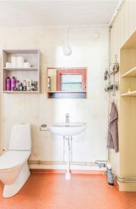 a bathroom with a toilet and a sink at Beautiful house in Fränsta in Fränsta