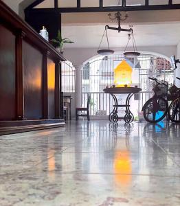 a room with a table with a lamp on it at Hotel y Hostal Casa Don Alfonso in Valladolid