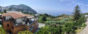 a house with a view of a mountain at Casa Pesce Rooms Rent in Serrara Fontana