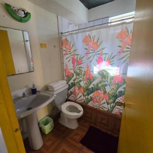 a bathroom with a sink and a toilet and a shower at Resivic in Antofagasta +31 photos