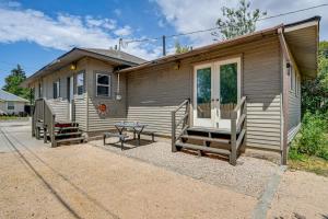 a small house with a porch and a table outside at 17 Mi to Bear Lake Lovely Family Home! in Montpelier
