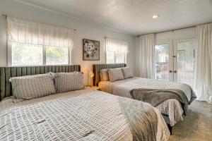 a bedroom with two beds and a window at 17 Mi to Bear Lake Lovely Family Home! in Montpelier