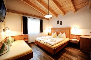 Posteľ alebo postele v izbe v ubytovaní Luxury Chalets Wiesenruh