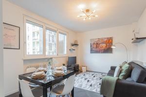 a living room with a table and a couch at Chiara's Apartment by Rent All Como in Como