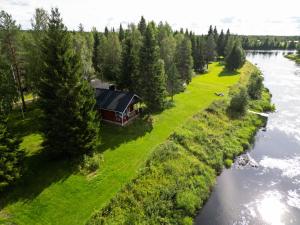 an aerial view of a house next to a river at Lapland Aurora Riverside in Raiskio +60 photos