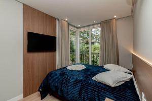 Postel nebo postele na pokoji v ubytování Lumiere 405 - Aconchego no coração de Canela