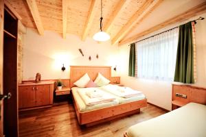 Posteľ alebo postele v izbe v ubytovaní Luxury Chalets Wiesenruh