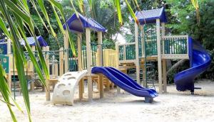a playground with a slide and a slideintend at Beautiful 4 Br3 Ba South Sound Home Wpool in George Town
