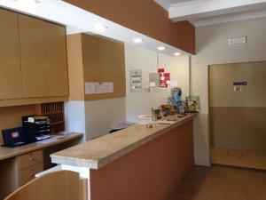 a large kitchen with a counter in a room at Vilamar in Luz
