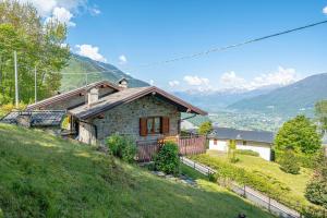 a small house on the side of a hill at La Rosa Bianca in Morbegno