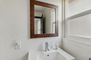 a bathroom with a sink and a mirror on the wall at Manzanita Holiday 2 in South Lake Tahoe +9 photos