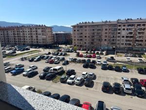 an aerial view of a parking lot with parked cars at Apartman "Paolo" Istočno Sarajevo in Vranješ