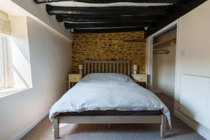 Postel nebo postele na pokoji v ubytování Newport cottage