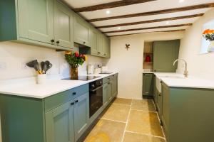 Kuchyň nebo kuchyňský kout v ubytování Newport cottage