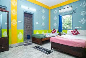 a bedroom with two beds in a room with snow themed walls at Binay chapa homestay in jaldapara in Mādāri Hāt