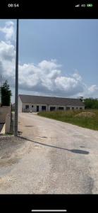 a building with a pole in the middle of a road at Jolie maison, plain-pied à Dole in Dole