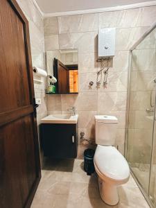 a bathroom with a toilet and a sink and a shower at A Peaceful Base for Exploring the Magic of Rize in Dikkaya +6 photos