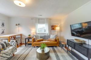 a living room with a couch and a tv at Shop, Dine and Unwind Dtwn Blowing Rock Retreat! in Blowing Rock