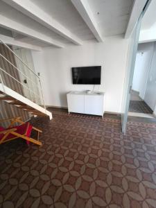 a room with a flat screen tv on a wall at Casa Ludovica in Catania +29 photos