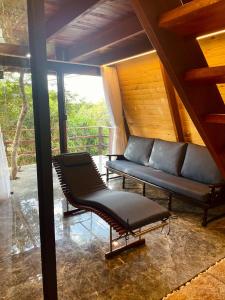 Et opholdsområde på Pousada paz e tranquilidade Chalé Lua Cheia + 14 billeder