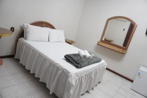 Giường trong phòng chung tại Hotel Minarini +8 ảnh