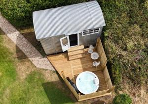 an overhead view of a hot tub in a backyard at Shepherds hut with Hot Tub pet friendly in Weymouth