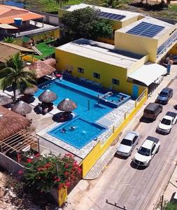 an overhead view of a building with a swimming pool at Viana Praia Hotel e Restaurante- Pontal do Peba-Piaçabucu in Piaçabuçu