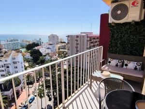 a balcony with a view of a city at Benalmadena Minerva - Ocean view 1 Bedroom apartm in Benalmádena