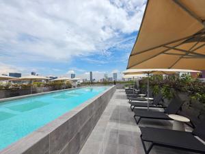 Πισίνα στο ή κοντά στο Cozy retreat bright spacious and calm